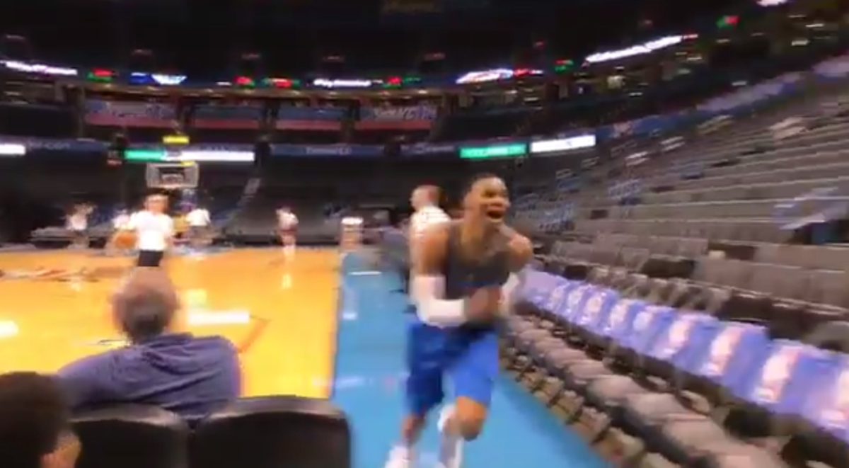 Russell Westbrook runs away from the court, saying something about Kyrie.