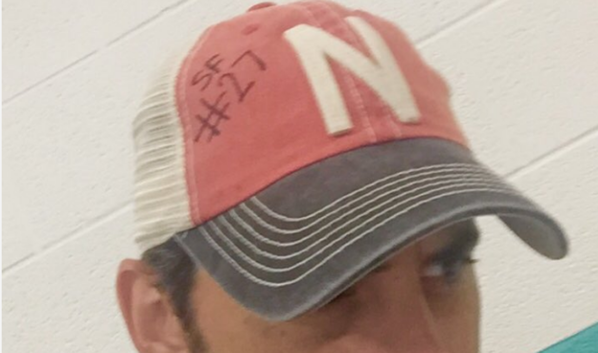 Brad Praisley wearing a Nebraska hat in honor of Sam Foltz.