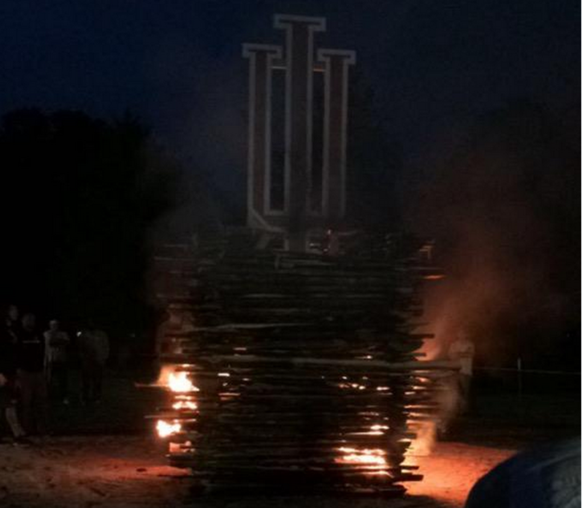 Wake Forest fans burning a massive Indiana logo.