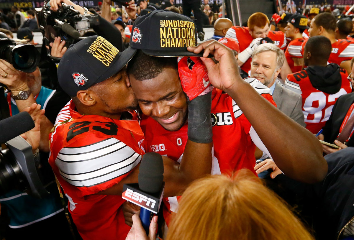 Tyvis Powell kissing Cardale Jones on the cheek after Ohio State wins the National Championship.