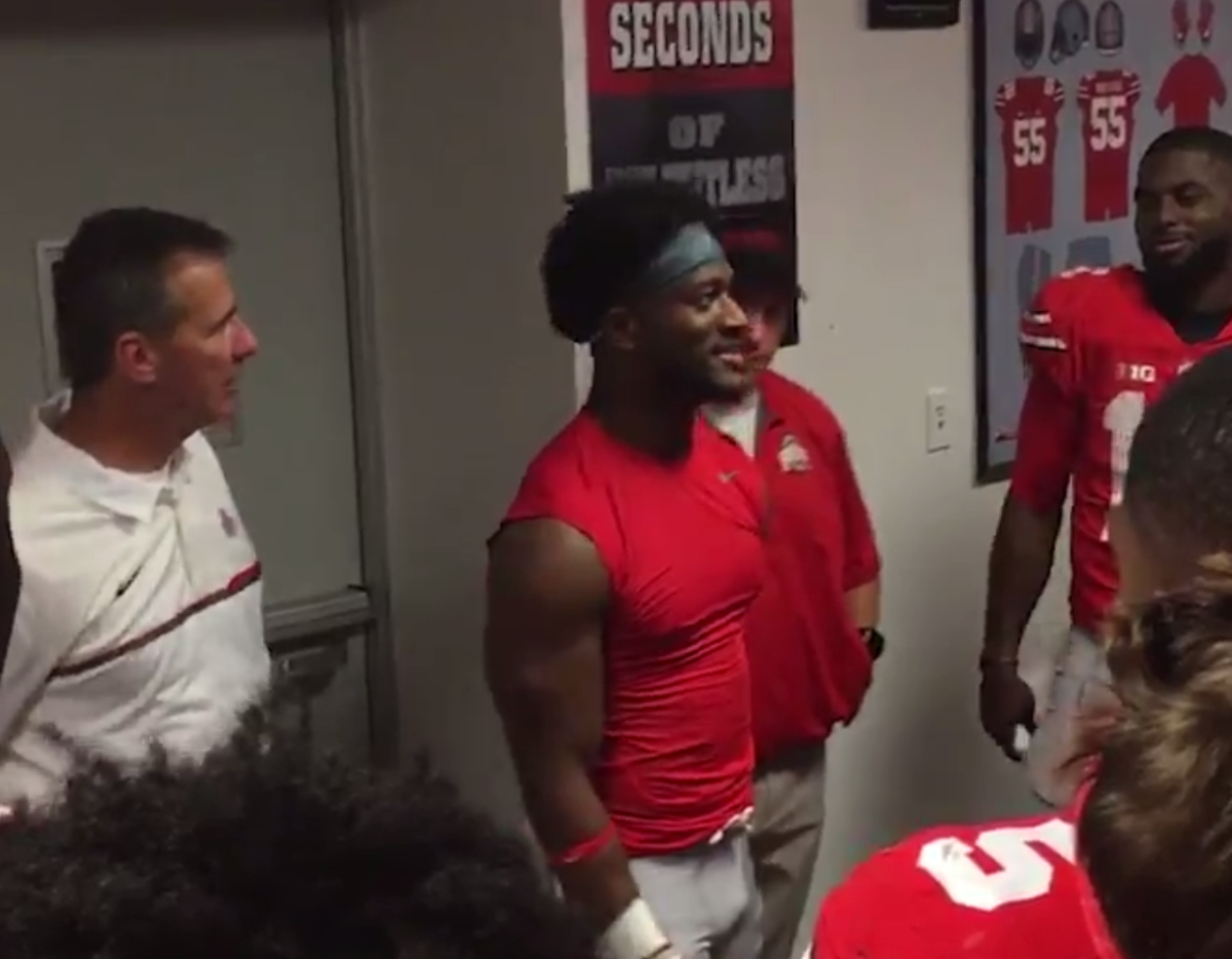 K.J. Hill talking to his teammates in the locker room.