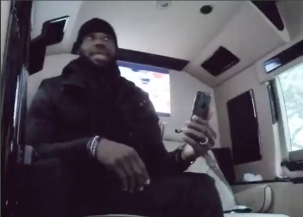 LeBron James sitting in a van.