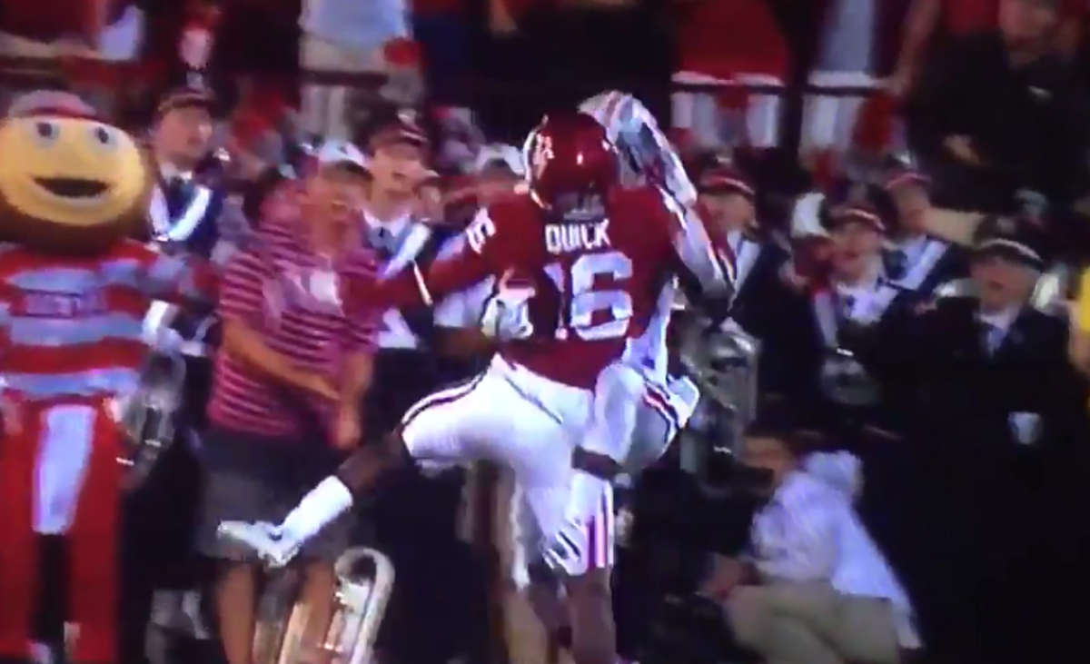 Noah Brown catching a touchdown pass by holding the ball against an Oklahoma player's back.