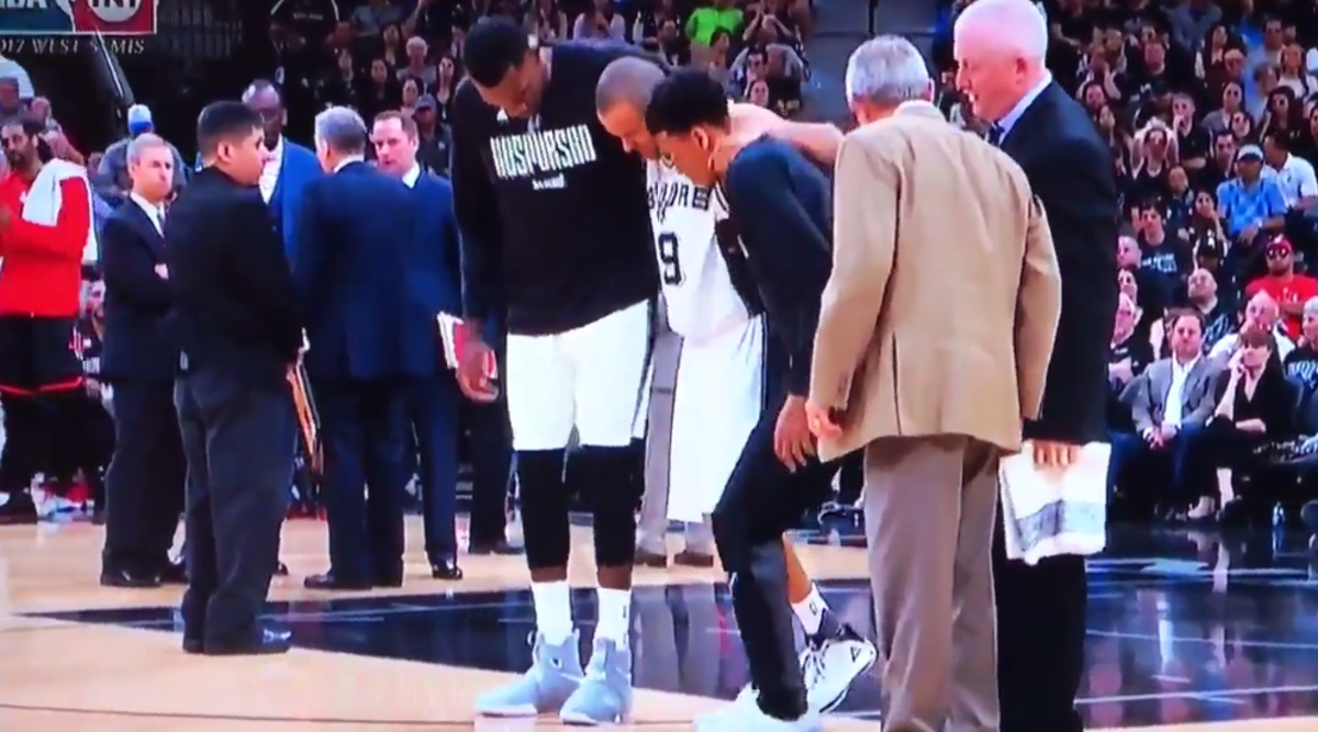 Tony Parker being carried off the court.