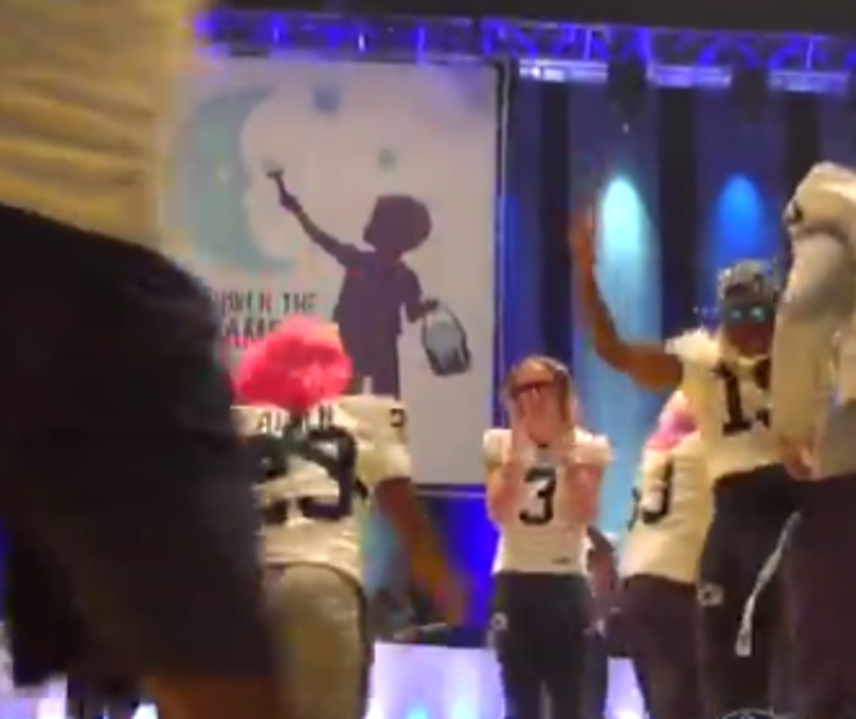 Penn State football players dance at THON.