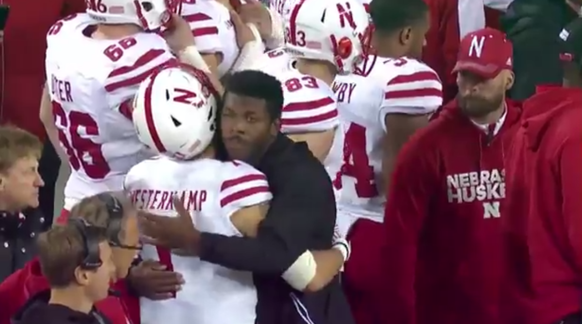 Tommy Armstrong hugs his teammates during a loss.