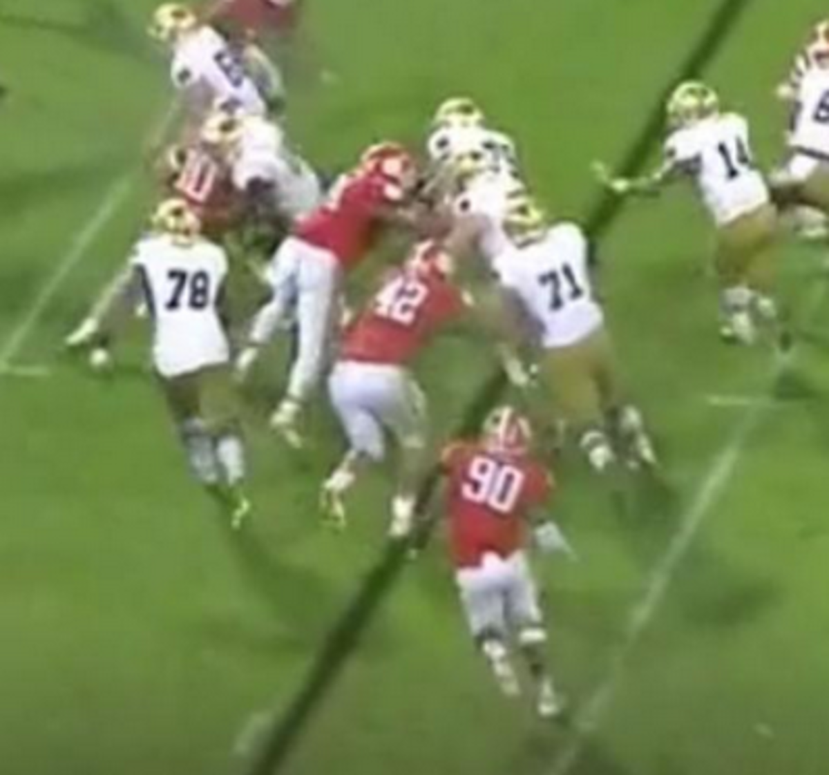 Clemson and Notre Dame players battle for position.
