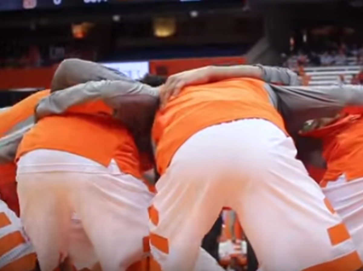 Syracuse players in a pregame huddle.