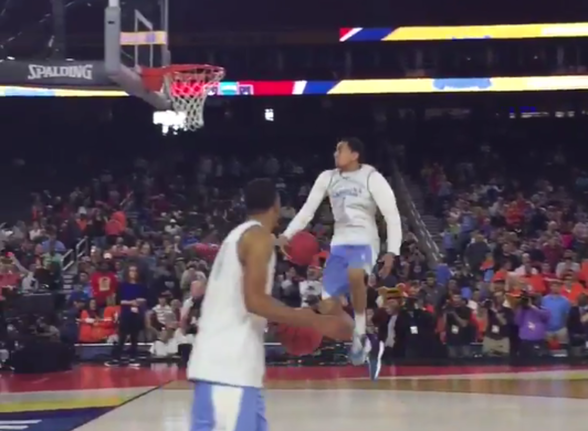 Marcus Paige goes between the legs for a dunk.