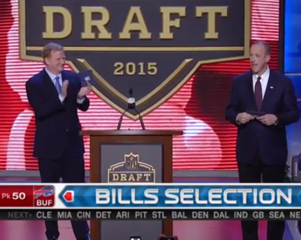 Jim Kelly gets applause from Roger Goddess and fans at the draft.