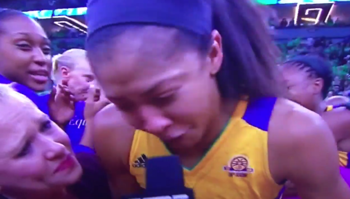 Candace Parker crying into a microphone