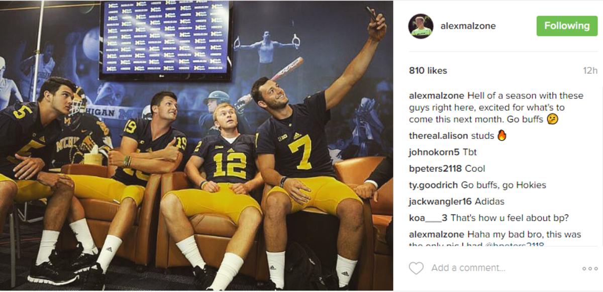 Michigan's players taking a selfie on a couch.