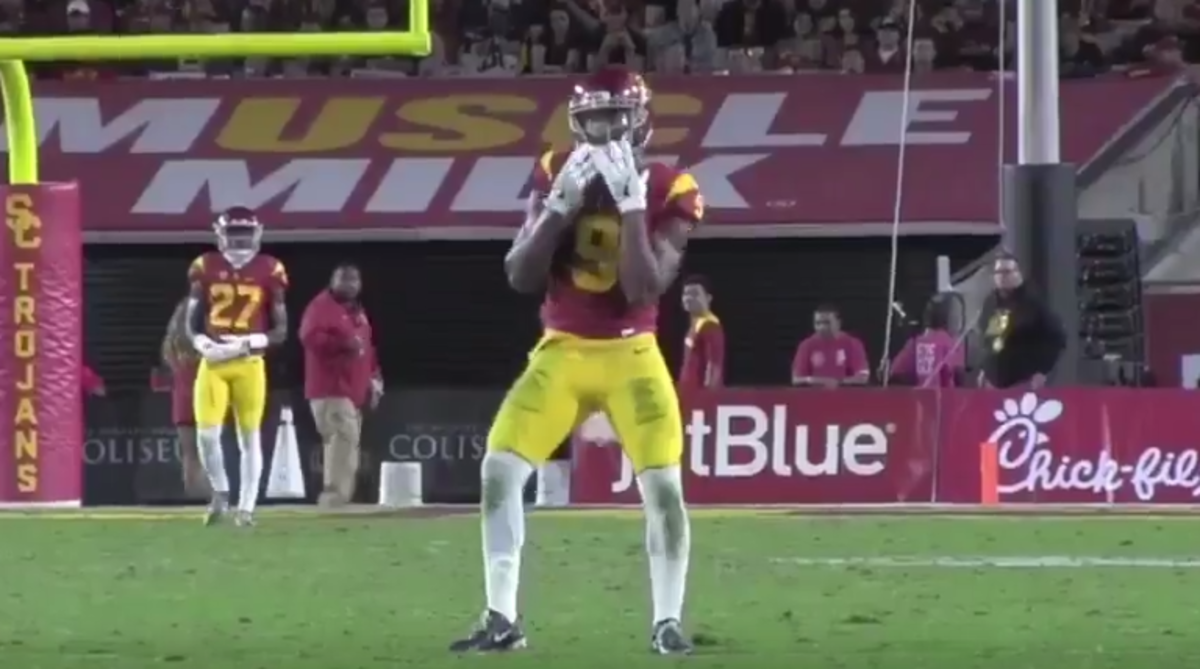 JuJu Smith-Schuster doing the 'juju on the beat' dance during a game.
