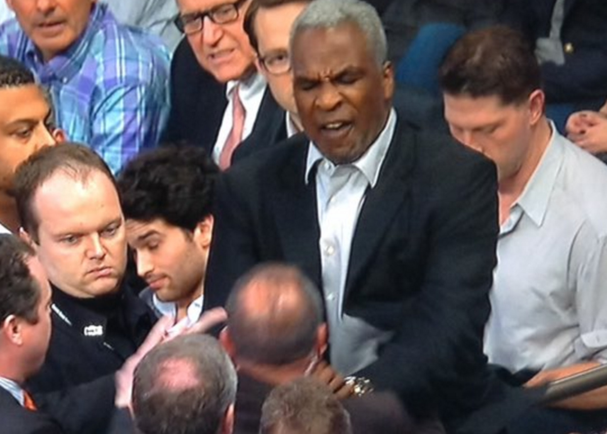 Charles Oakley fends off a security guard during his altercation at Madison Square Garden.