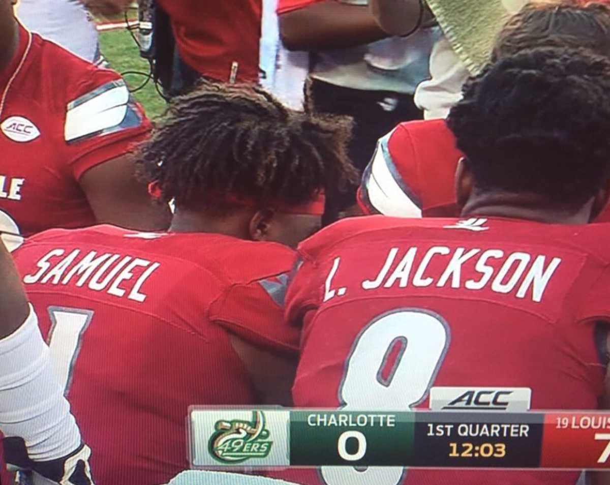 Two Louisville player's uniforms spelling out Samuel L. Jackson.
