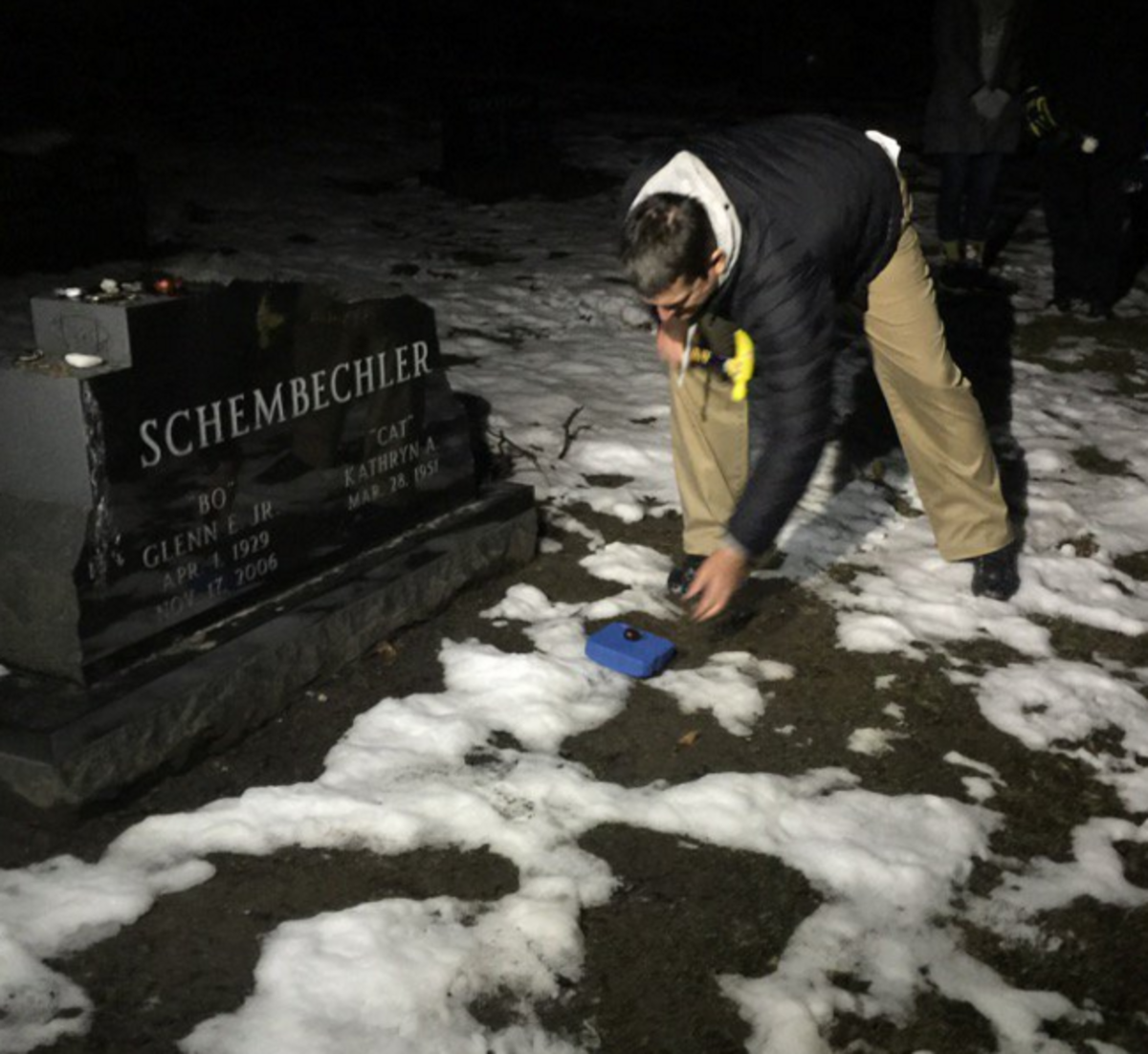 Jim Harbaugh next to Bo Schembechler's grave.