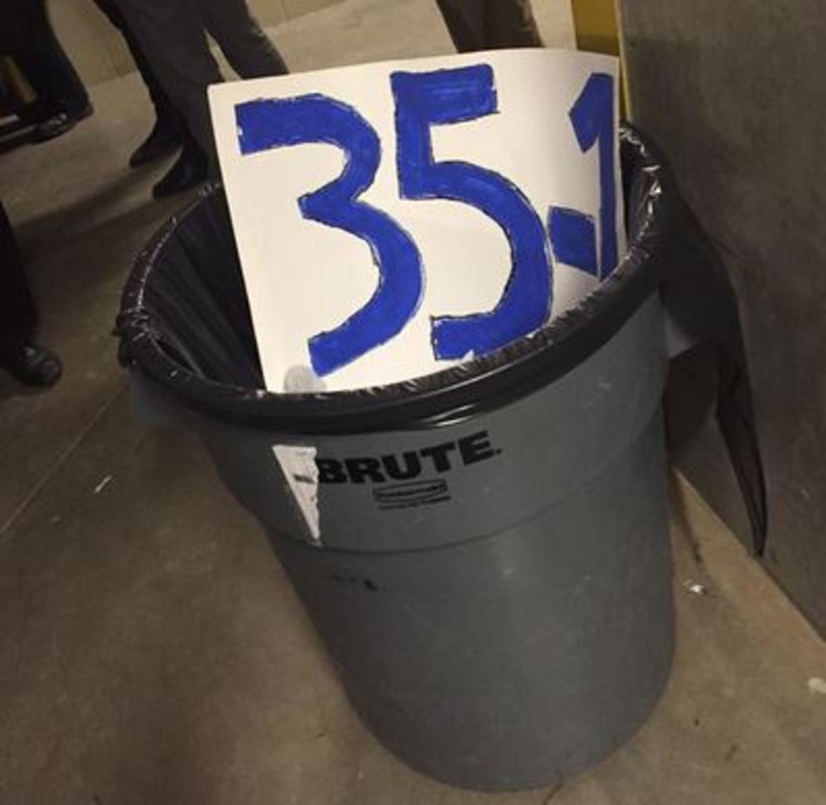 Cincinnati band member's 35-1 sign is thrown in trash.