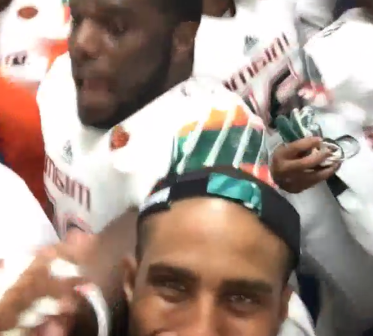 Miami celebrates win in locker room.