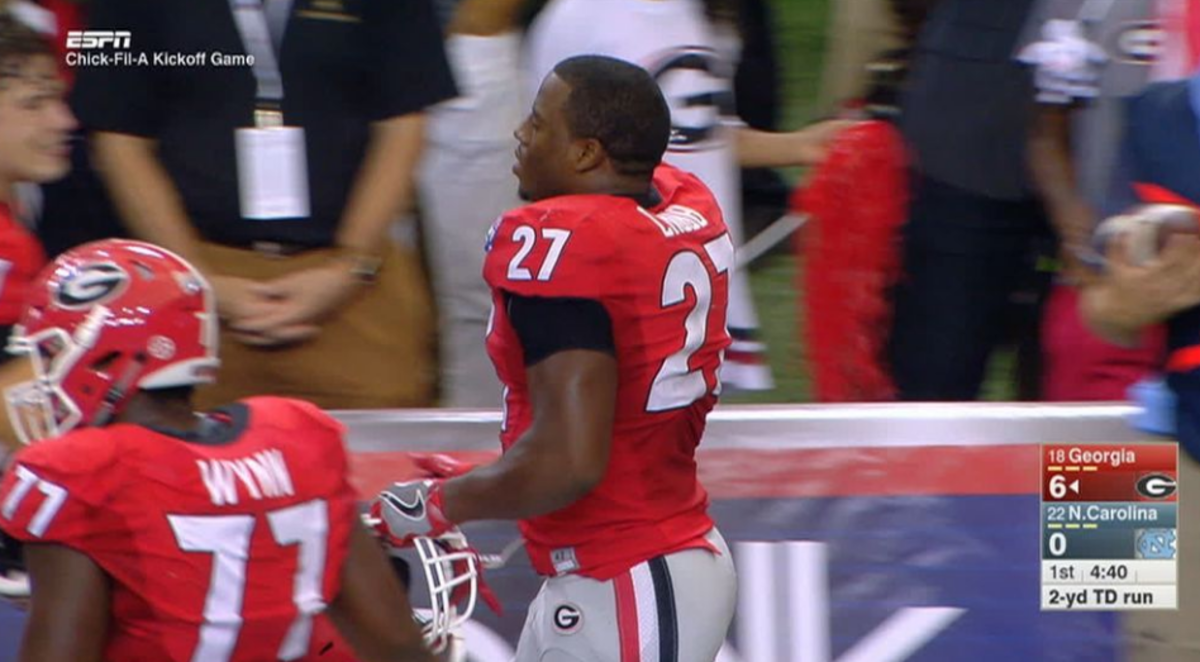 Nick Chubb walking on the sidelines following a touchdown.