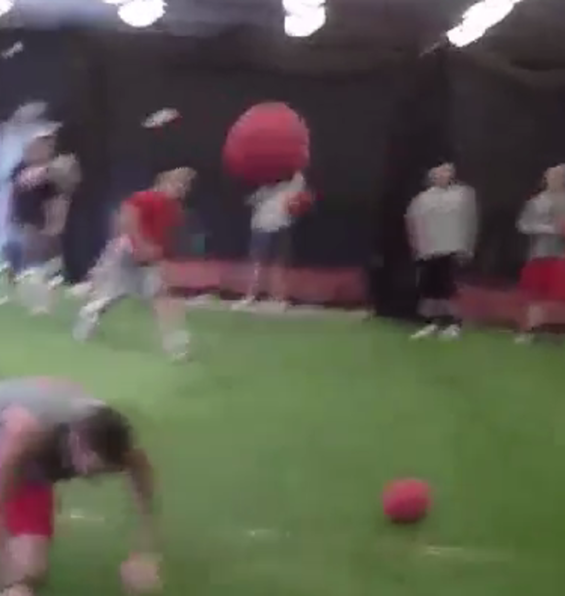 A dodgeball goes flying as the Ohio State football team plays dodgeball.