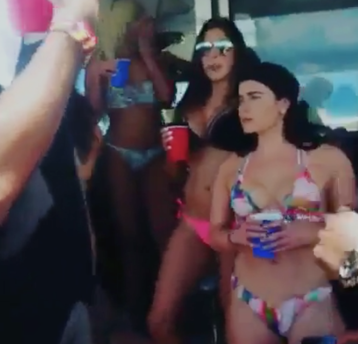 Kyrie Irving partying on yacht with bikini clad women.