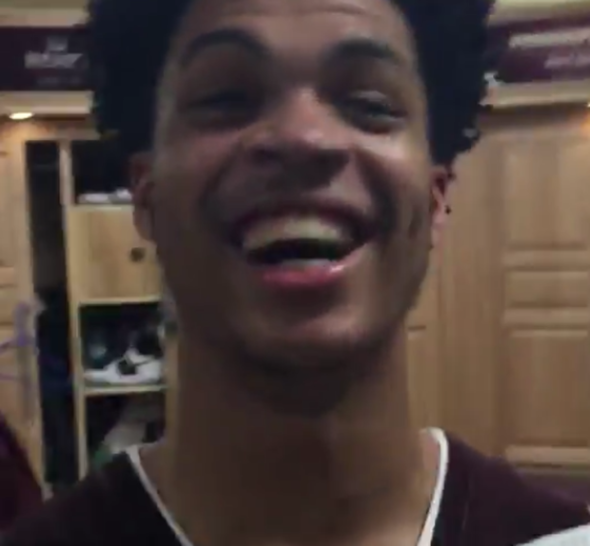 Mississippi State players celebrate win in locker room.