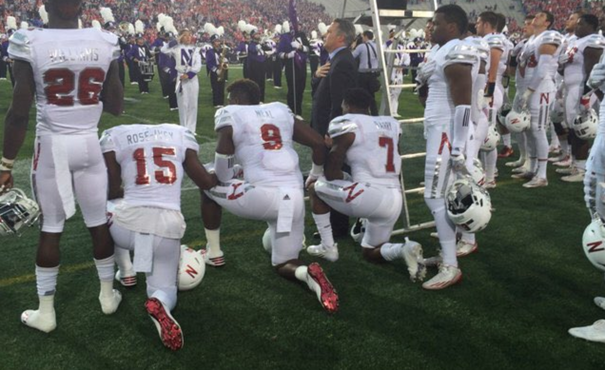 Nebraska players' protest by kneeling during the national anthem.