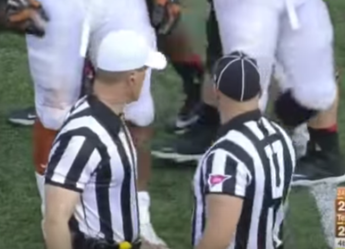 Referees discussing a call during the Texas vs. Oklahoma State game.