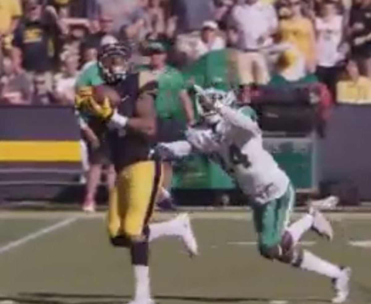 Iowa player makes a great over the shoulder catch.