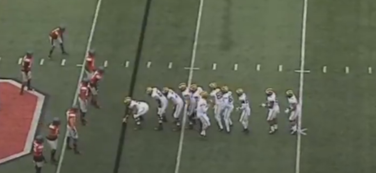 Michigan's players line up in the Train formation.