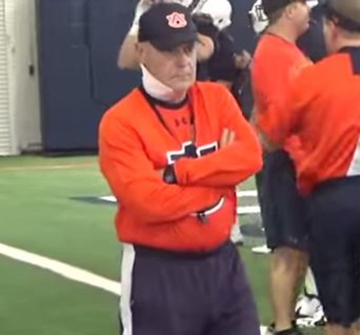 Auburn offensive line coach J.B. Grimes at practice days after cancer surgery.