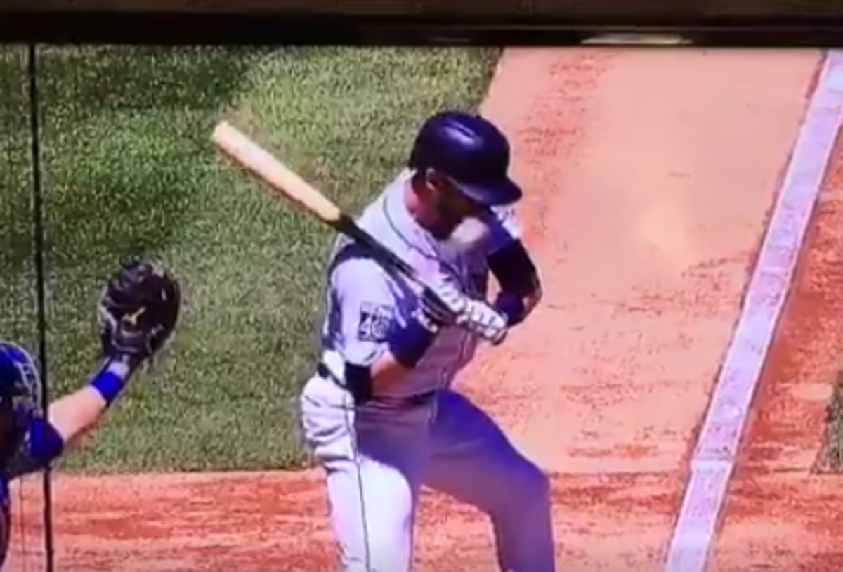 Mariners player Mitch Haniger being hit in the face.
