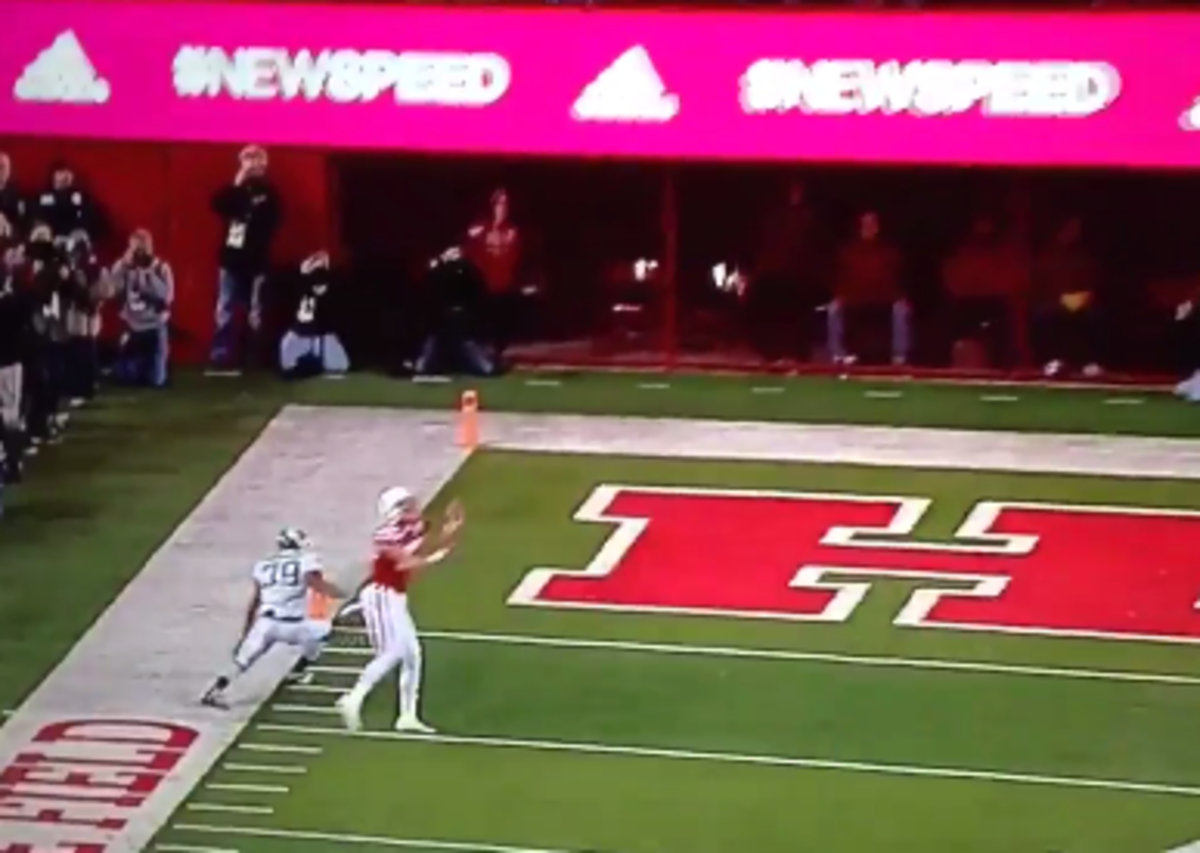 A Nebraska player makes a catch near the endzone.