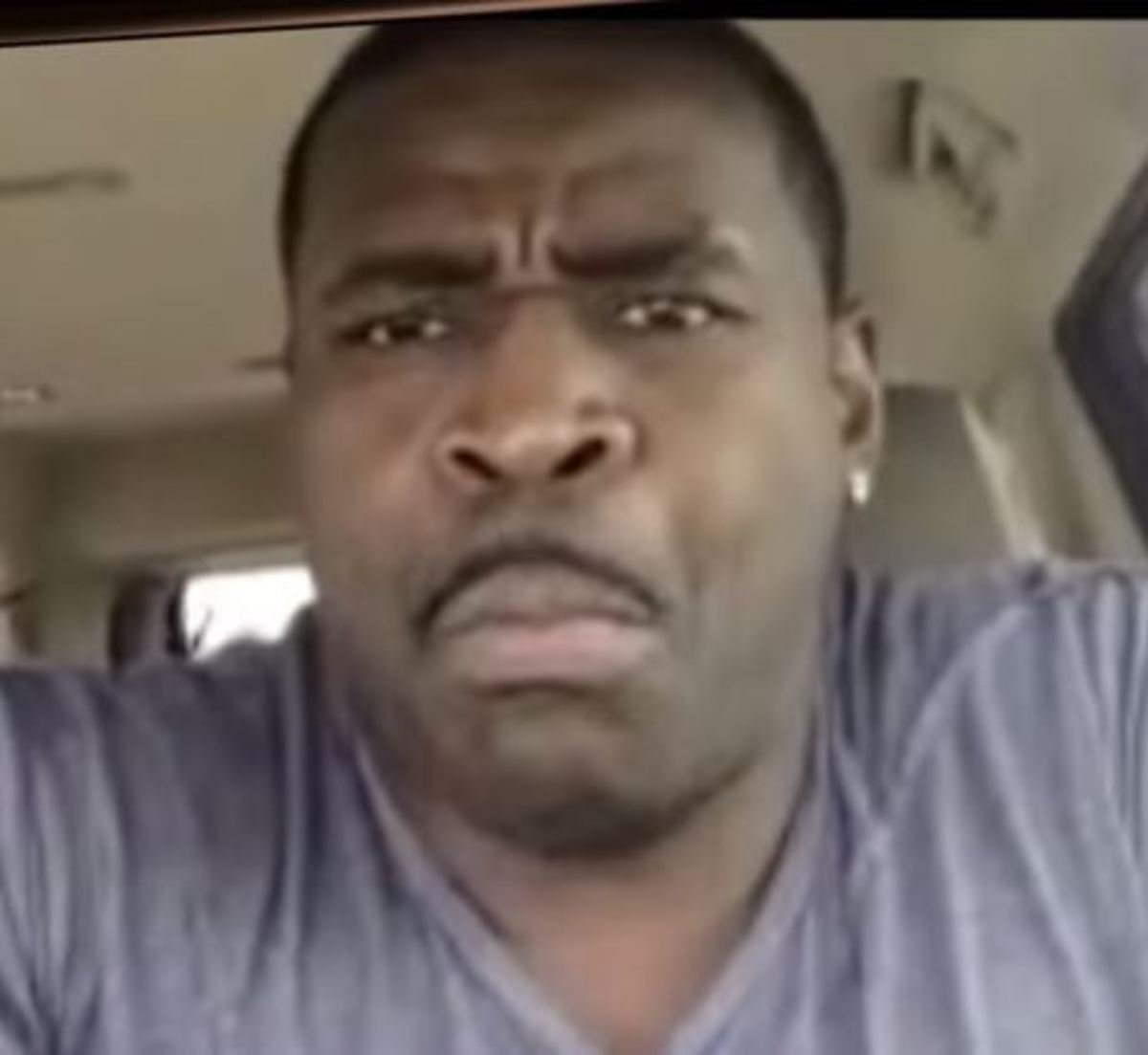 Michael Irvin making a face during a TMZ interview.