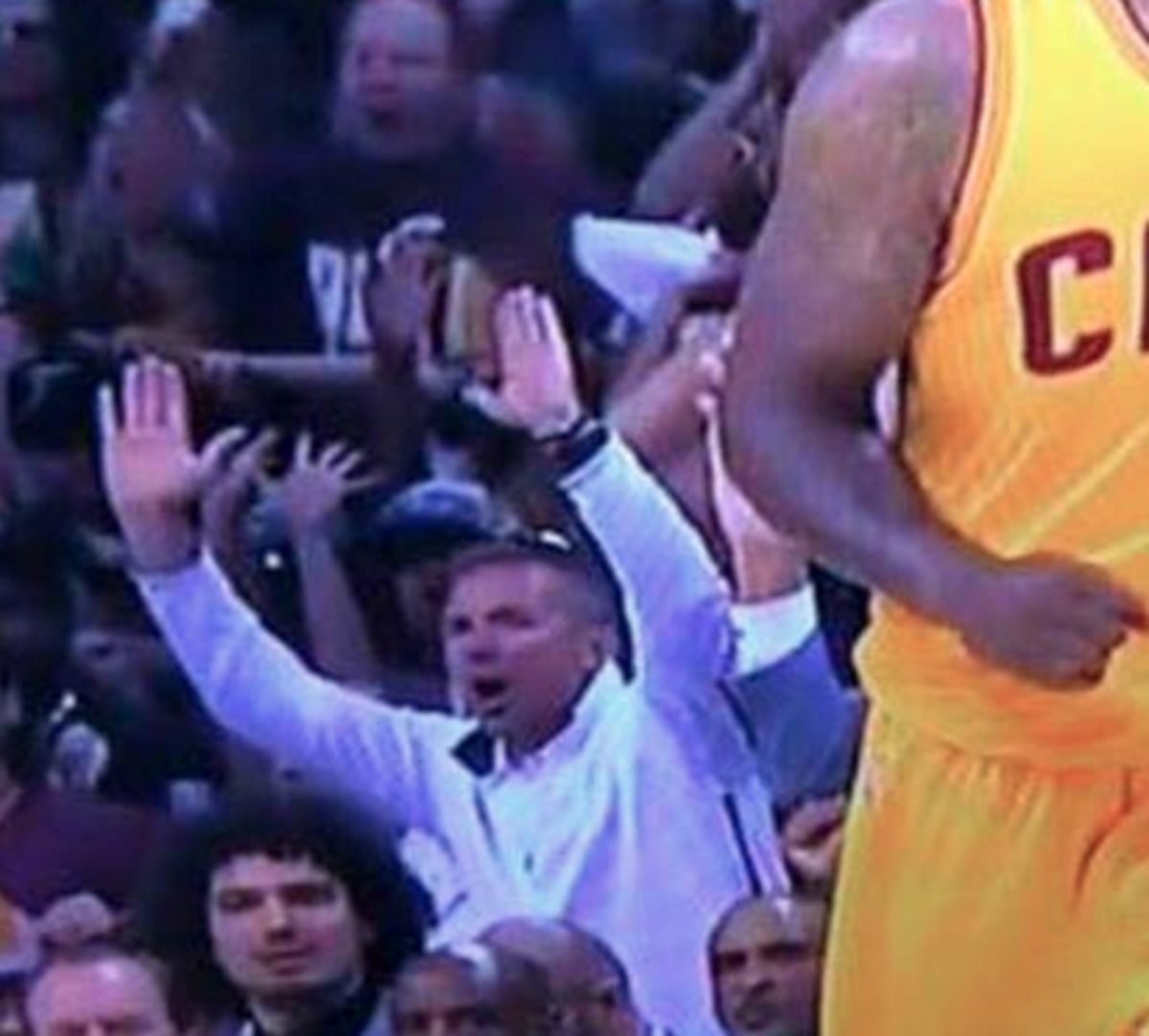 Urban Meyer shows excitement during the cavaliers game.
