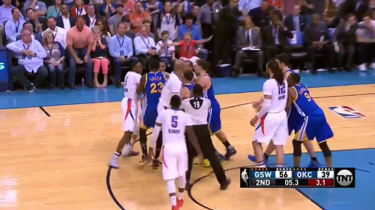 Thunder and Warriors players get into a scuffle.