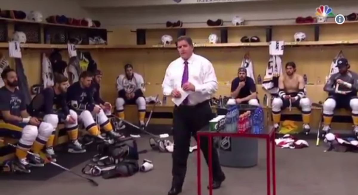 Hockey coach Peter Laviolette speaks in the locker room.