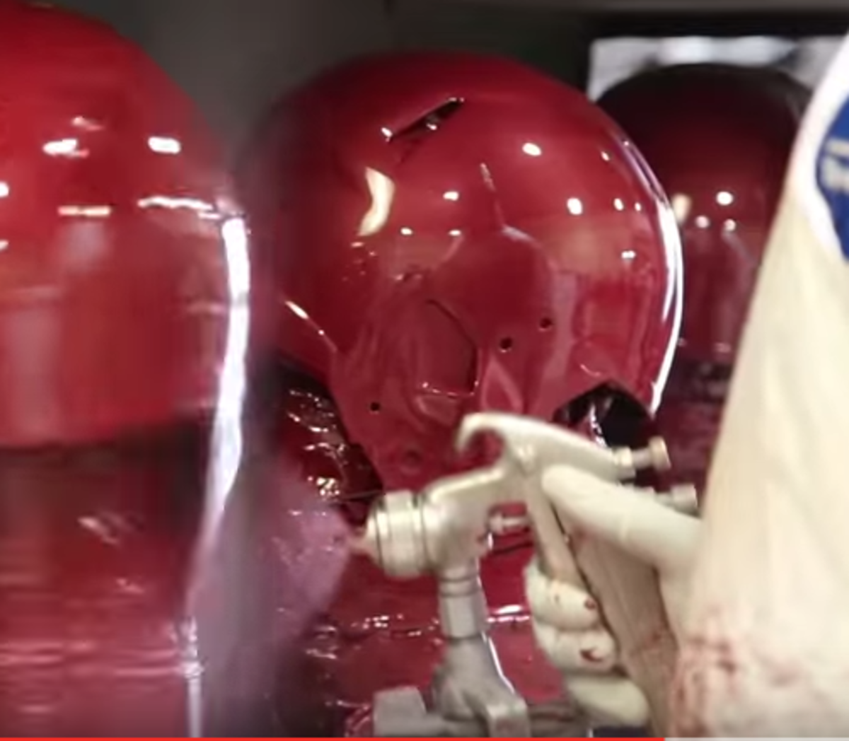 USC helmets being painted.