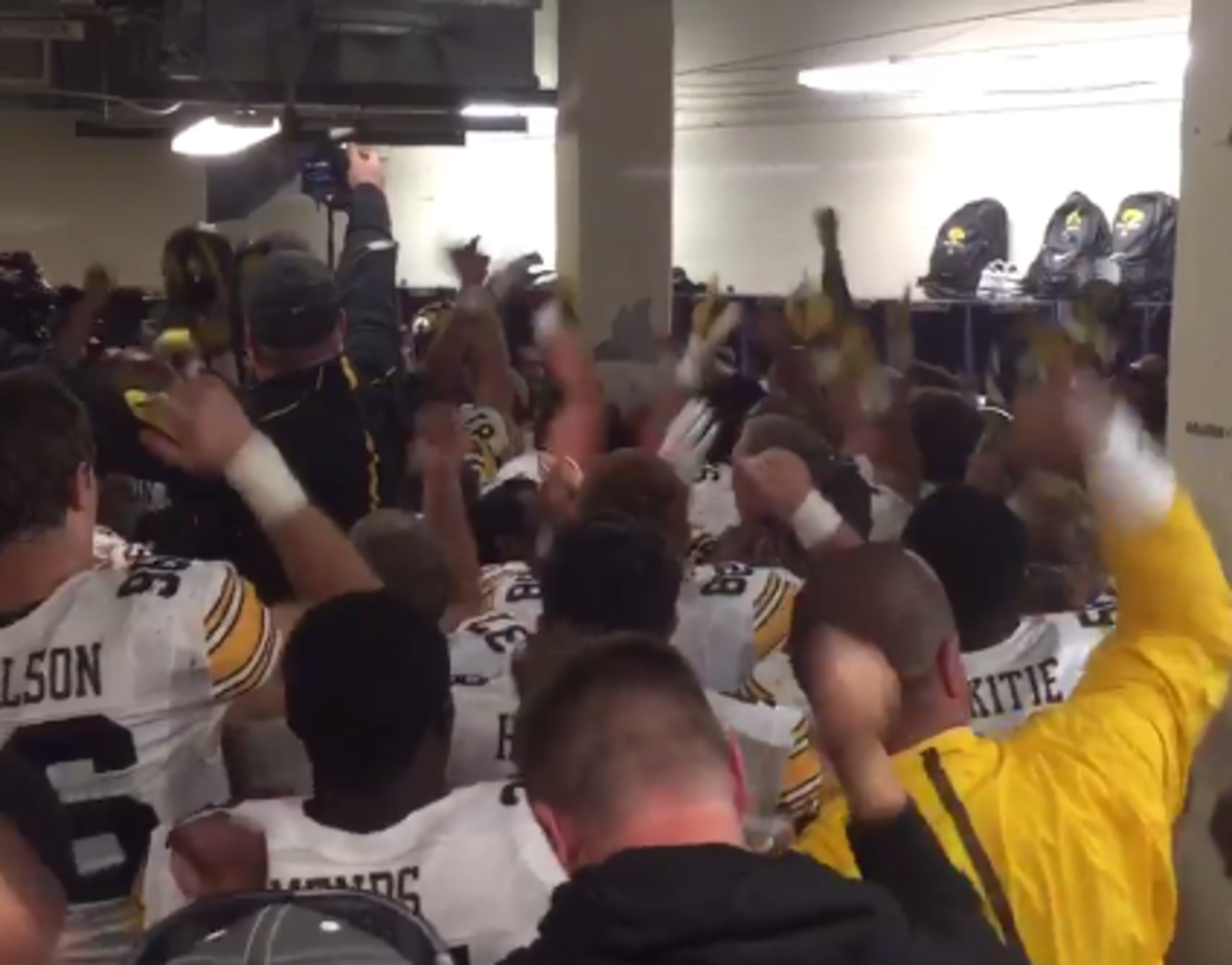 Iowa players and coaches celebrate after a big win against Northwestern.