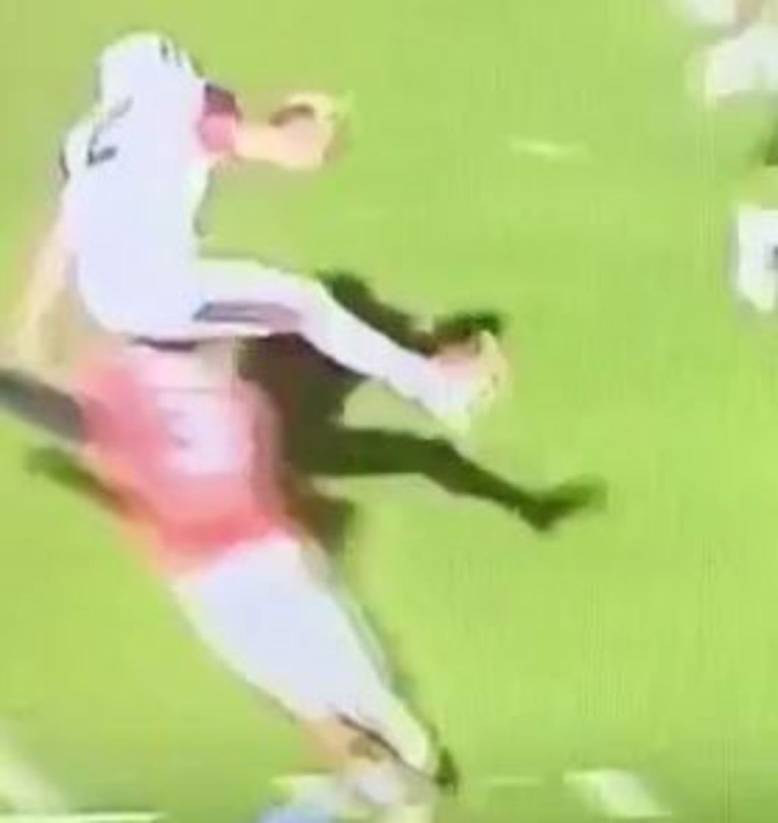 Syracuse quarterback Eric Dungey hurdles a Virginia defender.