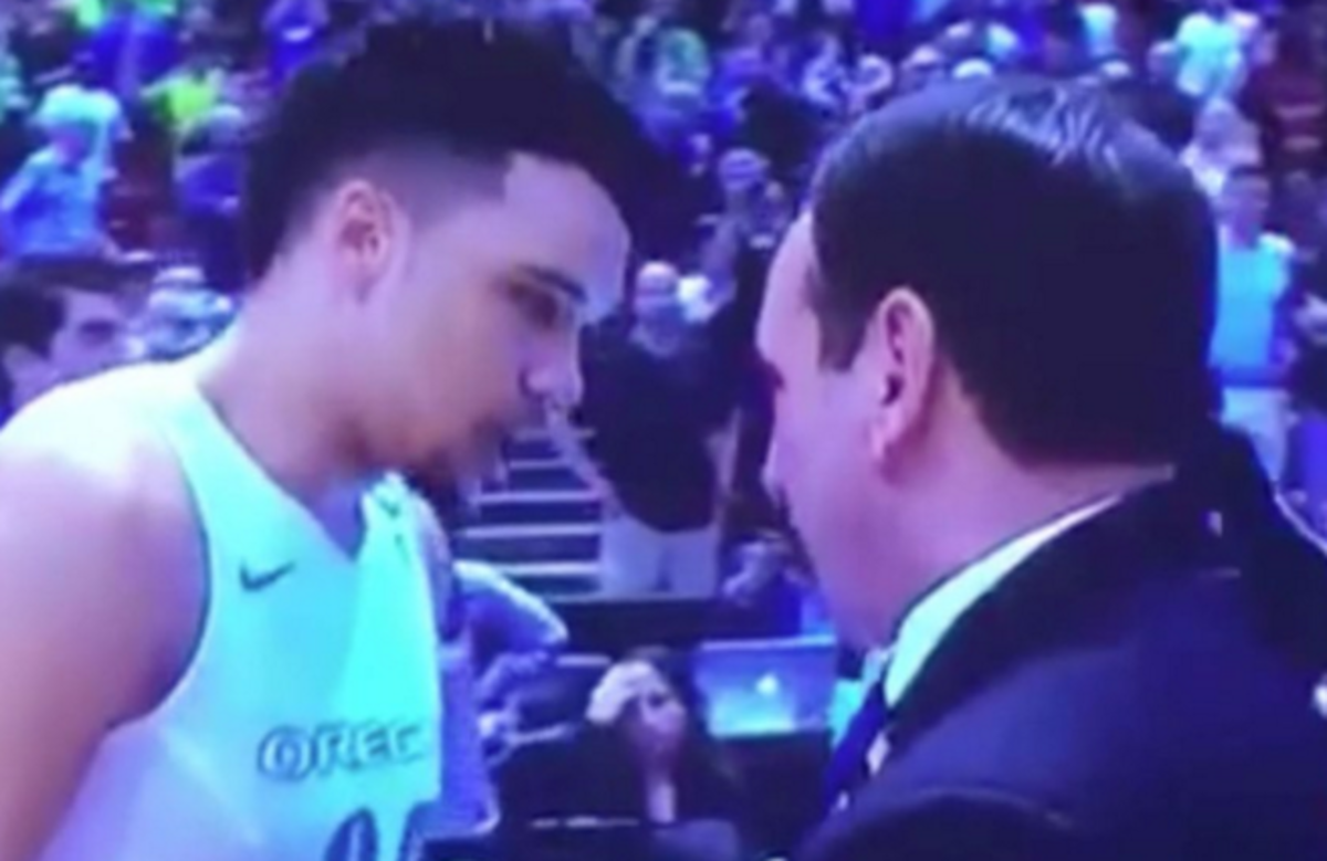 Coach K talks with Dillon Brooks after the game.