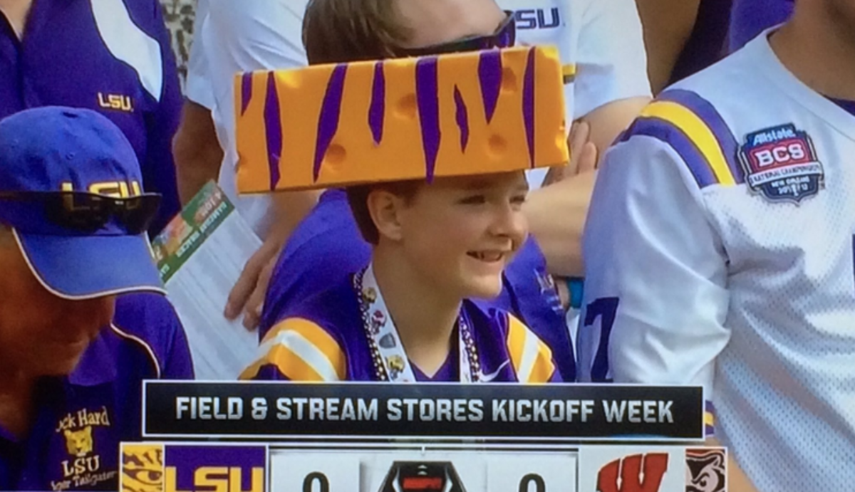 An LSU football fan wearing a block of cheese on top of his head.