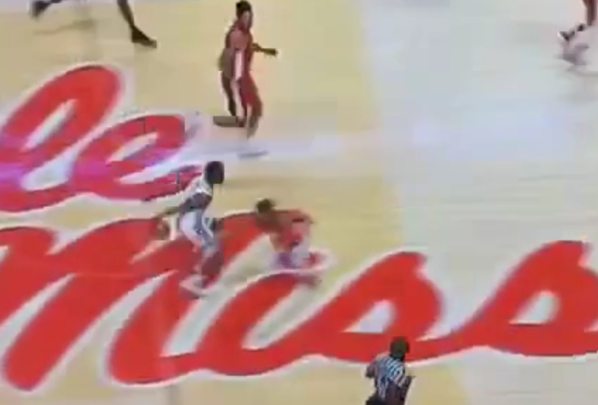 Malik Monk crosses over a defender.