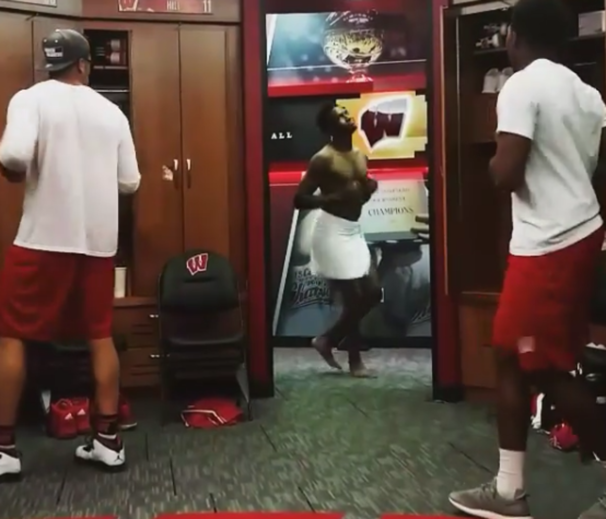 wisconsin basketball team dances in the locker room.