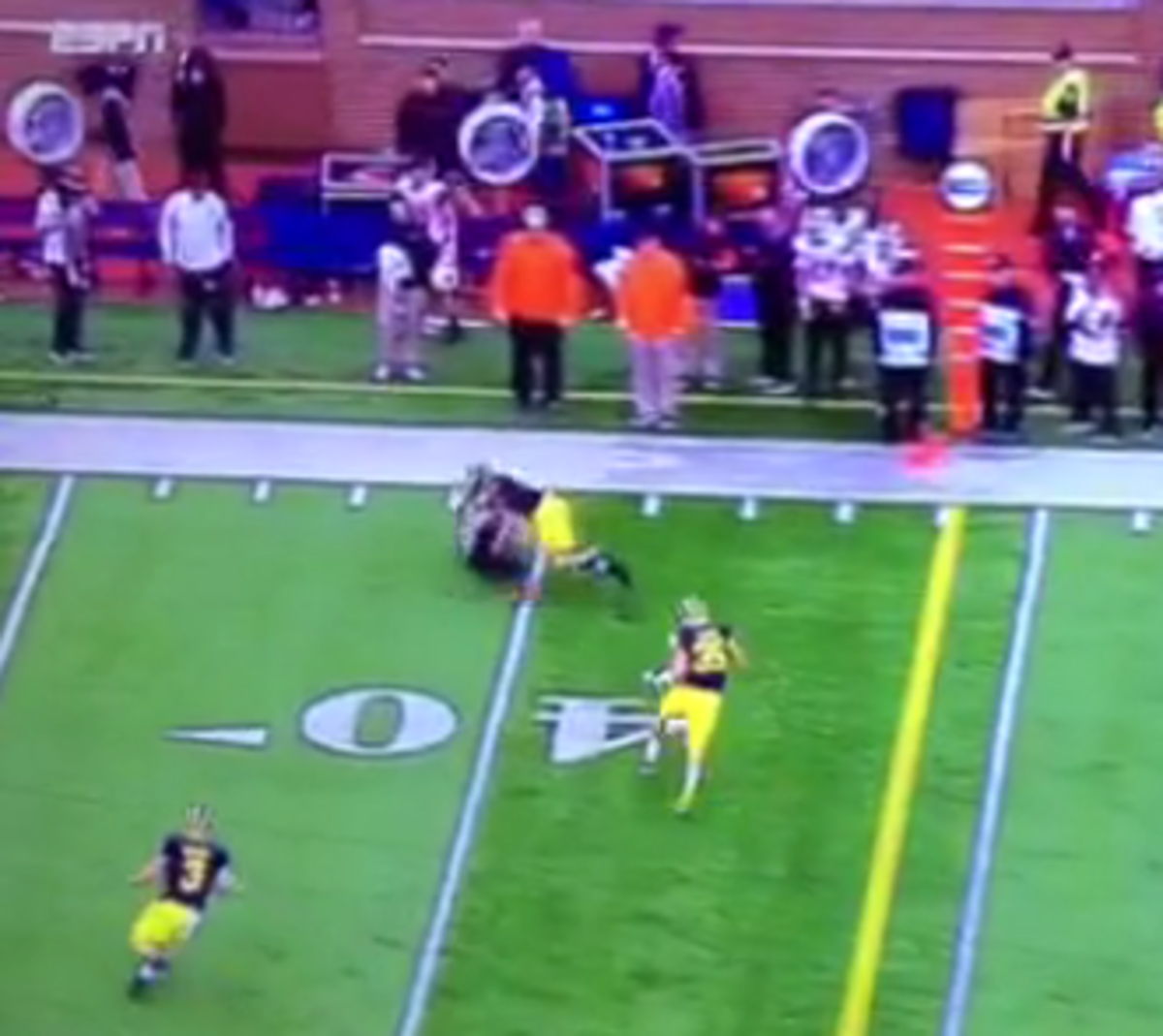 Jabrill Peppers lays a big hit on an Oregon State player.