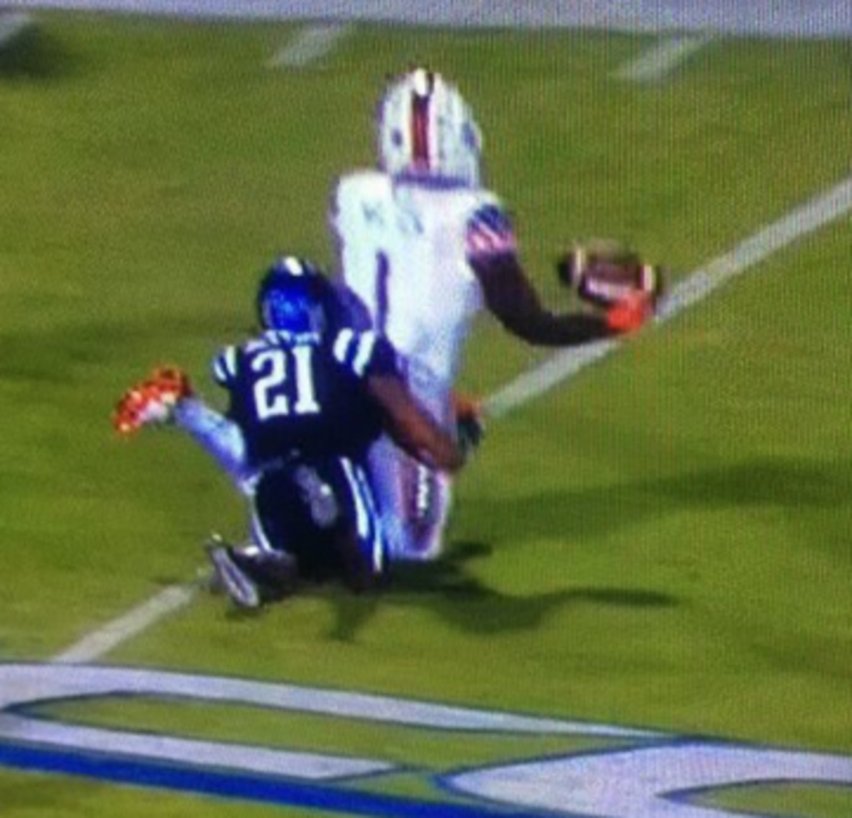 Miami football player is seen down.