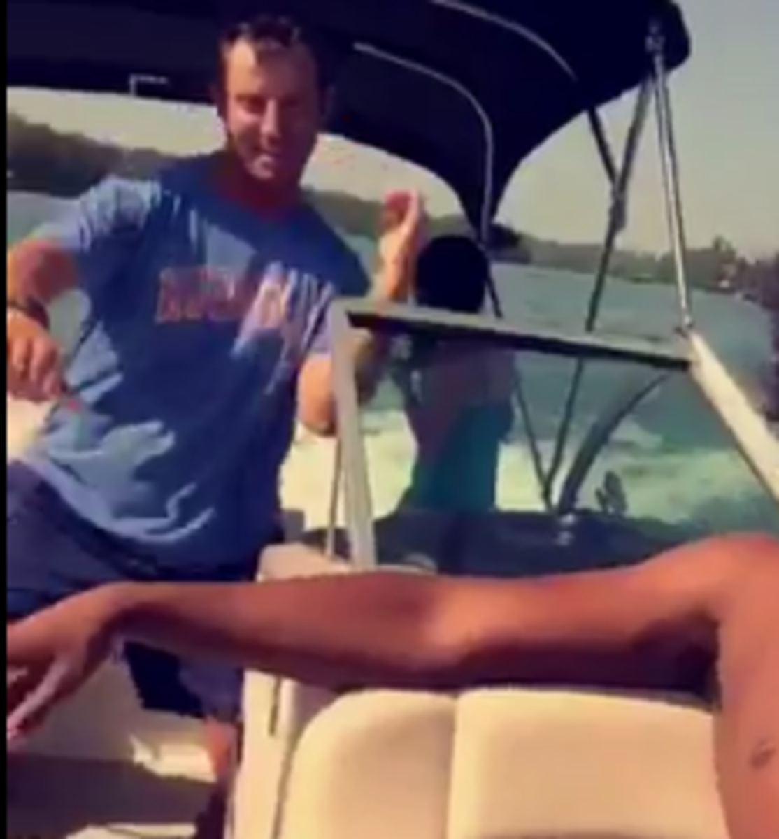 Dabo Swinney hitting The Whip on a boat.