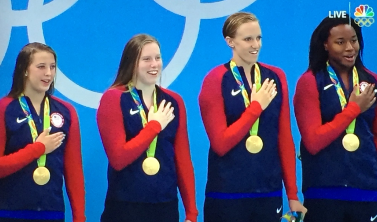 United State women's swim team lined up during the medal ceremony.