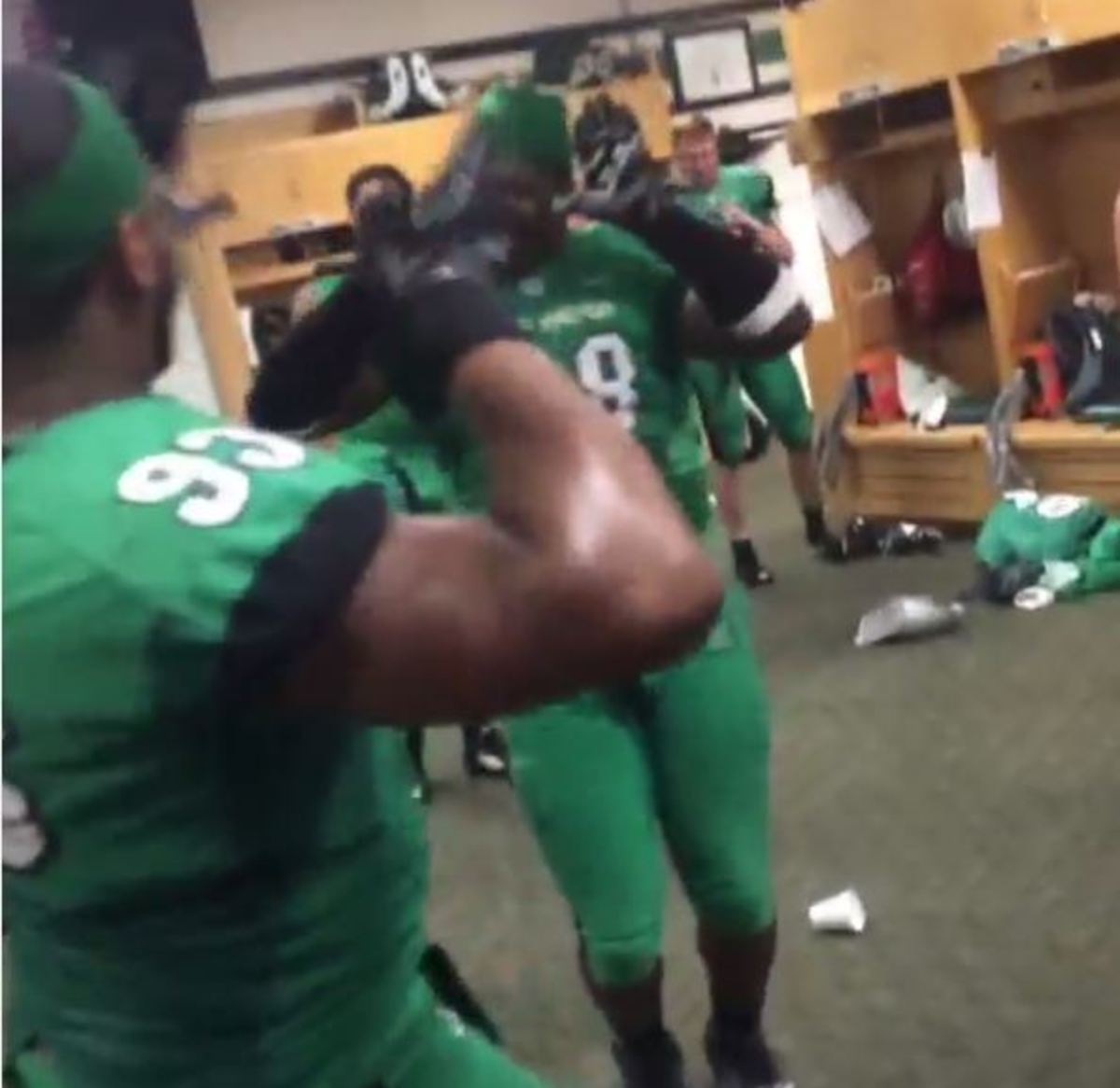 Marshall players fired up in the locker room after win over Purdue.