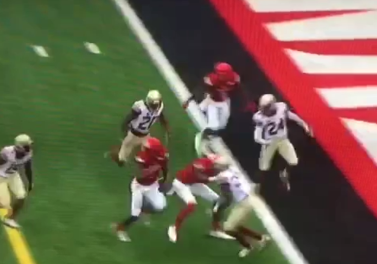 Lamar Jackson running into the end zone against florida state